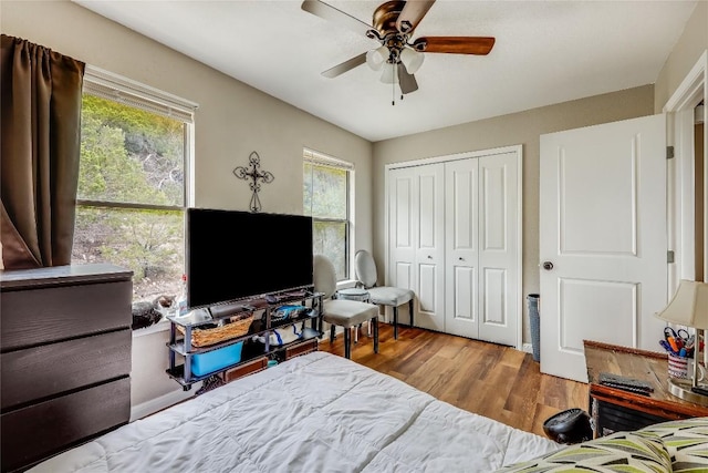 21461 Coyote Trl Unit 6, Lago Vista, TX 78645 - bedroom featuring wood finished floors, a closet, and ceiling fan