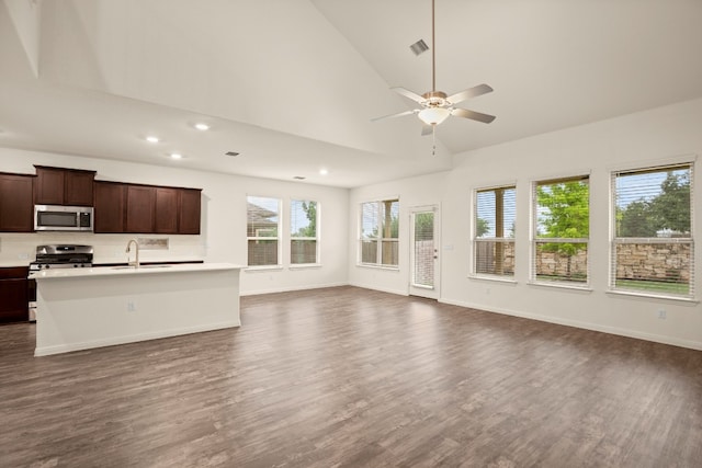 unfurnished living room with ceiling fan, sink, high vaulted ceiling, and dark hardwood / wood-style floors