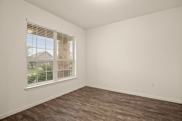 unfurnished room featuring dark hardwood / wood-style flooring