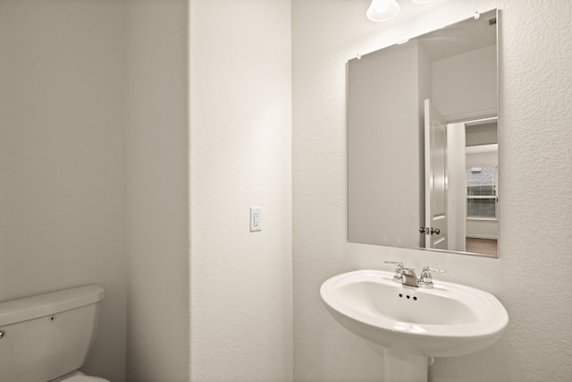 bathroom with sink and toilet