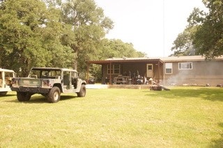 view of yard with a carport