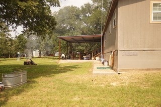 view of yard with a carport