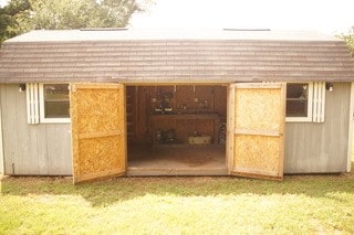 view of shed / structure with a lawn