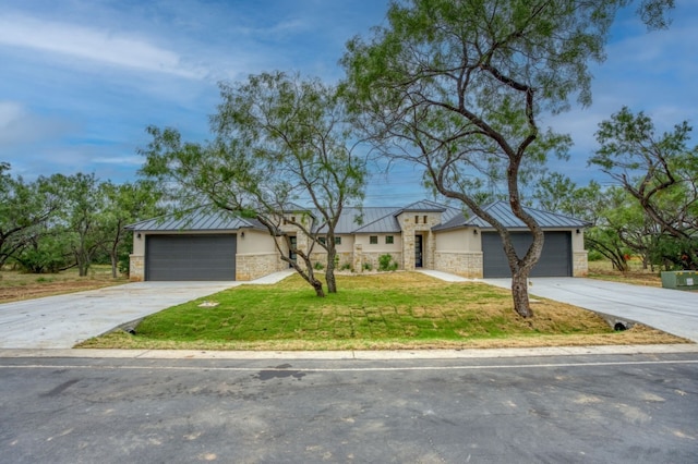 ranch-style house with a garage and a front lawn