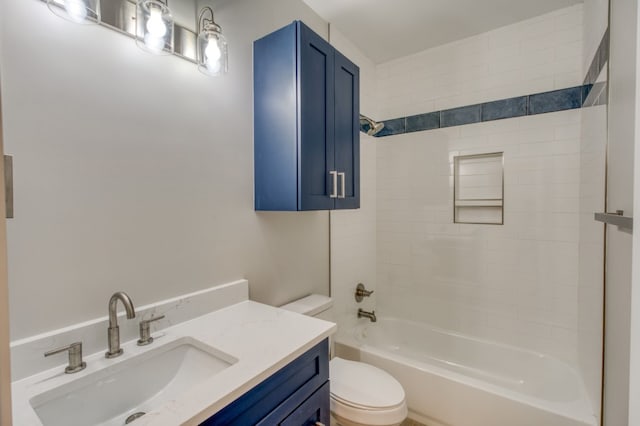 full bathroom featuring vanity, toilet, and tiled shower / bath