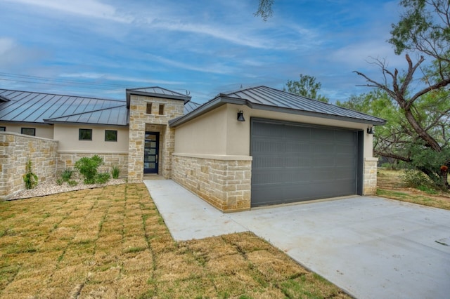 view of front of house with a front yard and a garage