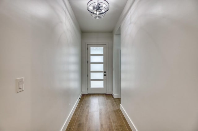 entryway with hardwood / wood-style floors