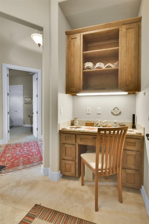 office space featuring light tile floors