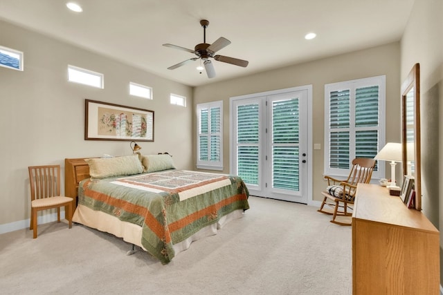 carpeted bedroom with ceiling fan, multiple windows, french doors, and access to outside