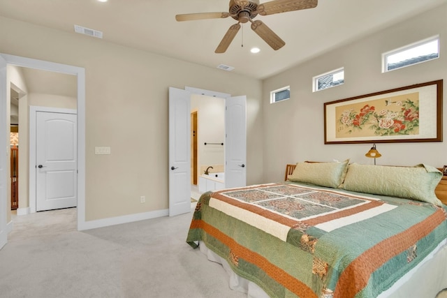 bedroom with carpet, ensuite bath, and ceiling fan