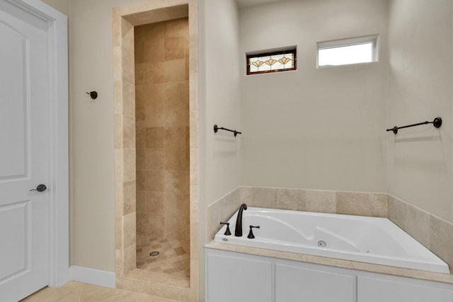 bathroom with separate shower and tub and tile floors