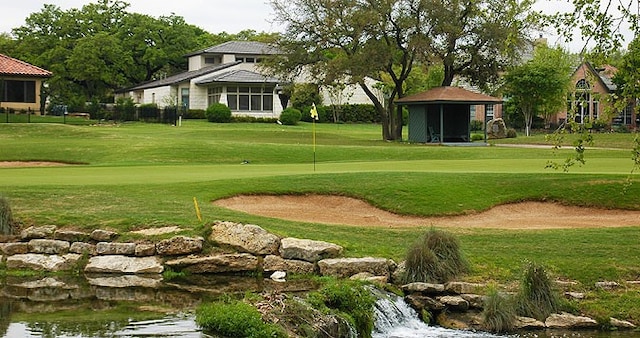 view of home's community featuring a yard