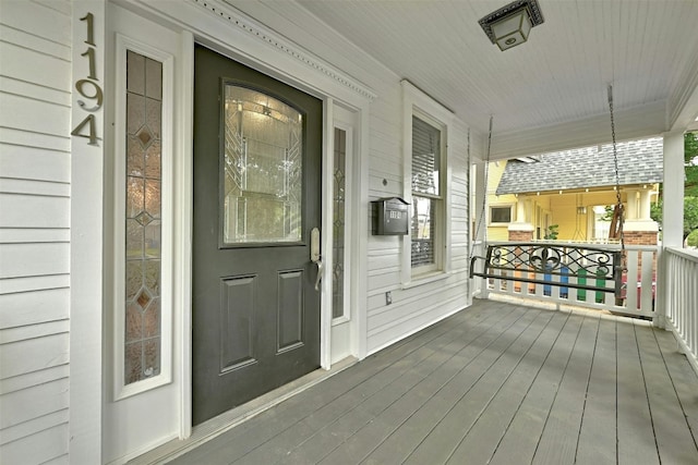 wooden terrace featuring a porch