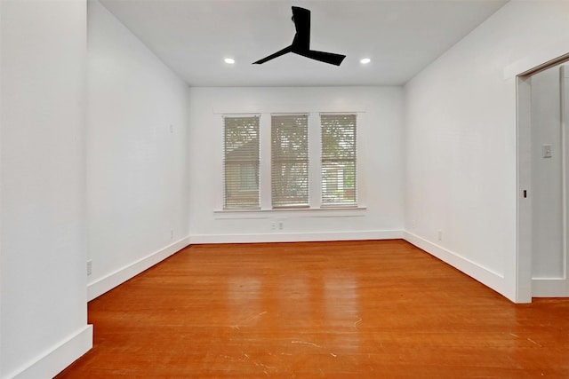 spare room with wood-type flooring