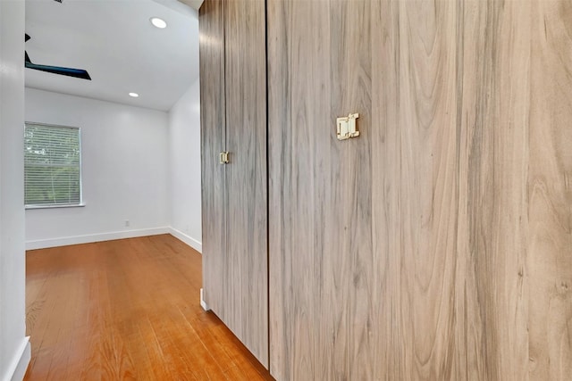 hallway with light wood-type flooring