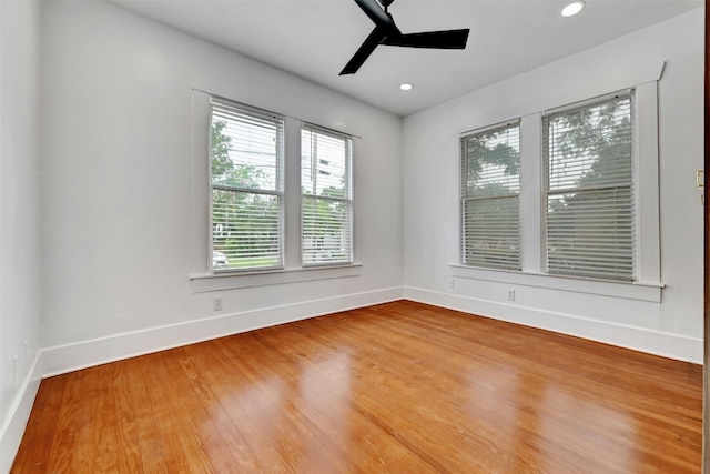 unfurnished room with ceiling fan and wood-type flooring