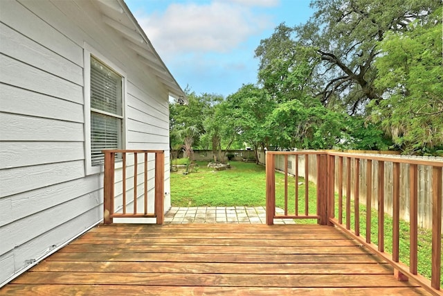 wooden deck with a lawn