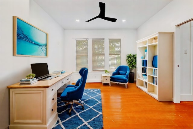 office with ceiling fan and light hardwood / wood-style floors