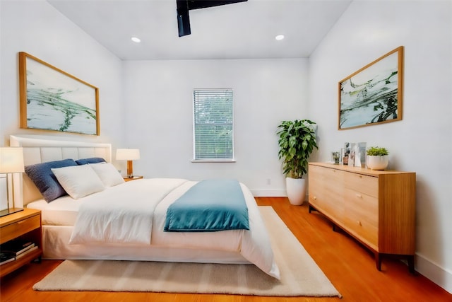 bedroom featuring ceiling fan and hardwood / wood-style flooring