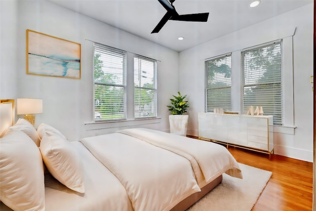 bedroom featuring hardwood / wood-style flooring and ceiling fan