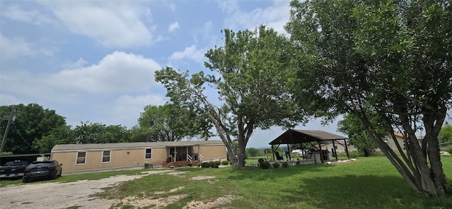 view of front facade featuring a gazebo and a front yard