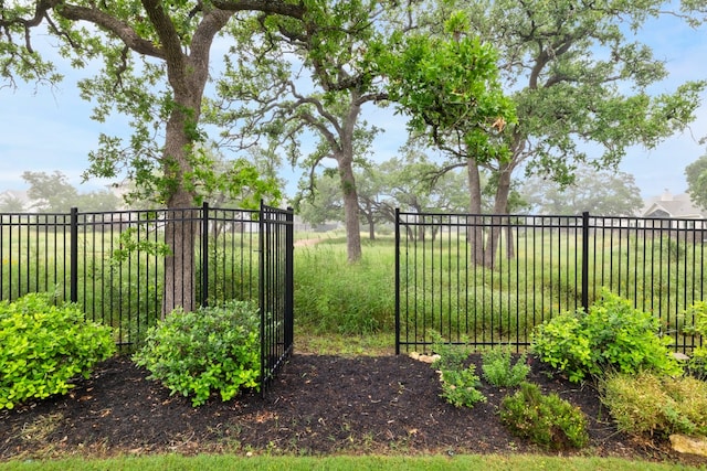 view of gate featuring fence