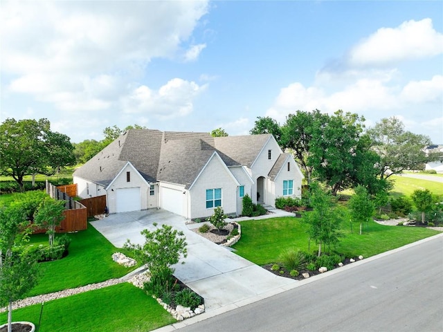 view of front of property with a front lawn and a garage