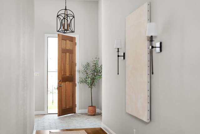 foyer entrance with an inviting chandelier