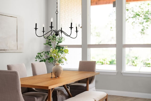 dining area featuring baseboards and a wealth of natural light