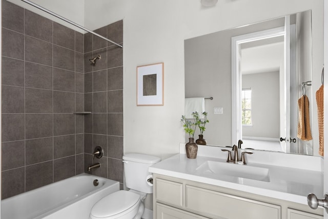 bathroom with shower / bath combination, vanity, and toilet