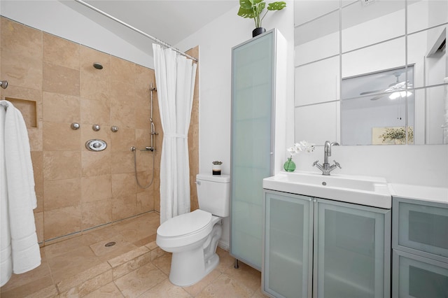 bathroom with toilet, ceiling fan, vaulted ceiling, a shower with curtain, and vanity