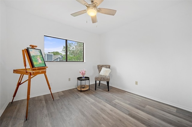 unfurnished room with ceiling fan and wood-type flooring