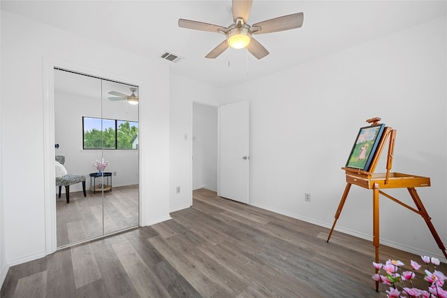 spare room featuring ceiling fan and wood-type flooring