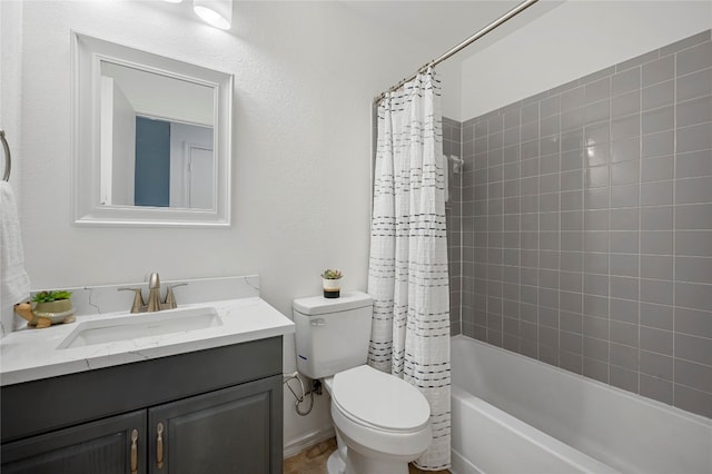 full bathroom with toilet, vanity, and shower / bath combo