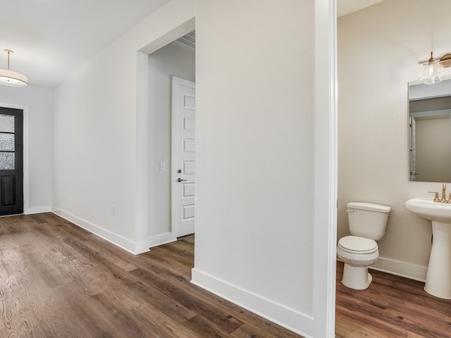 entrance foyer featuring dark wood-type flooring