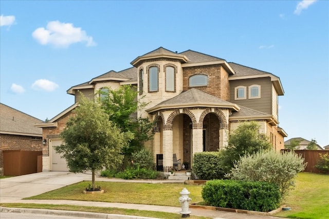 view of front facade with a front lawn and a garage