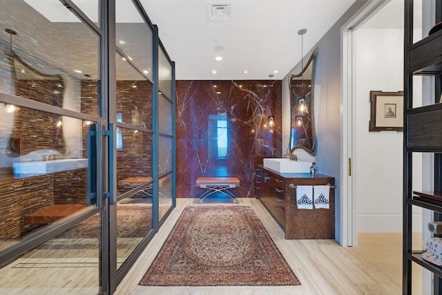 bathroom with hardwood / wood-style flooring and sink