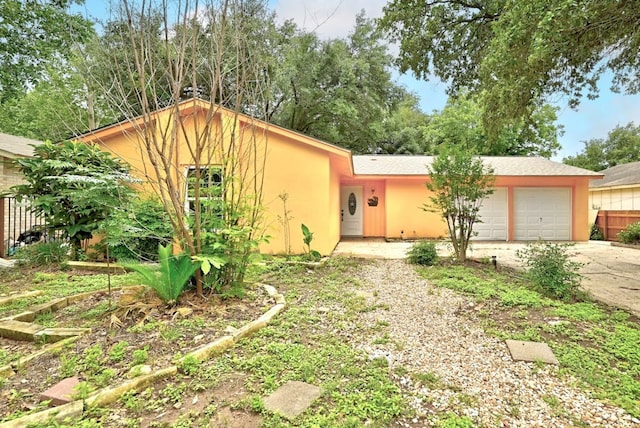 ranch-style house featuring a garage