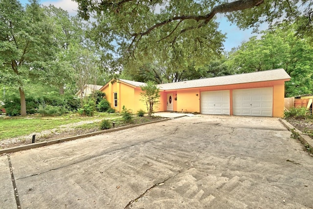 ranch-style house featuring a garage