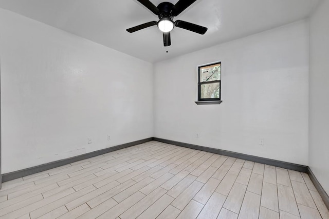 empty room featuring light hardwood / wood-style flooring and ceiling fan