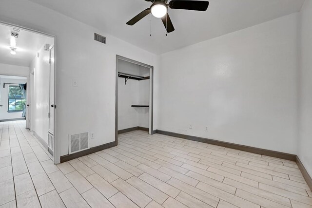 unfurnished bedroom featuring a closet and ceiling fan