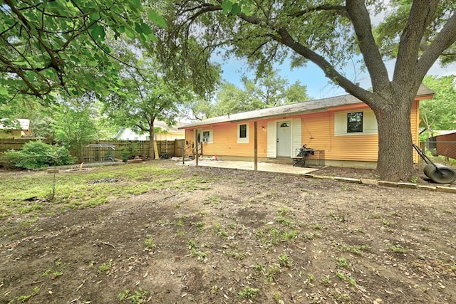 rear view of property featuring a patio area