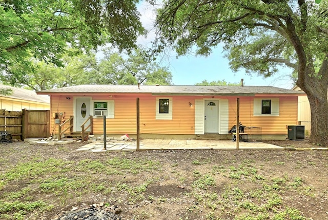 rear view of property featuring central AC