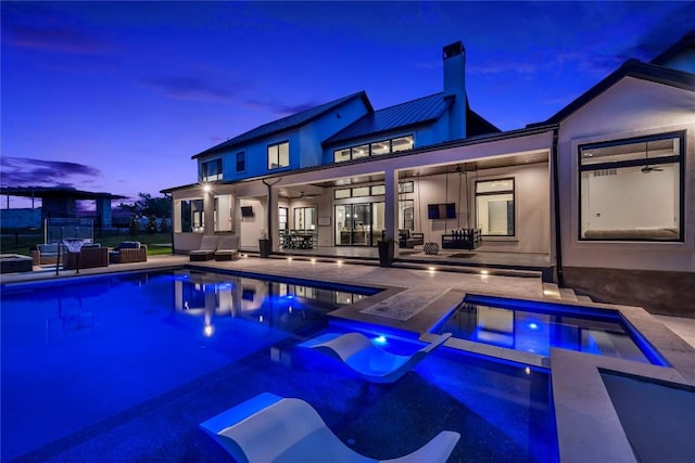 outdoor pool featuring a ceiling fan, a patio area, and an outdoor living space