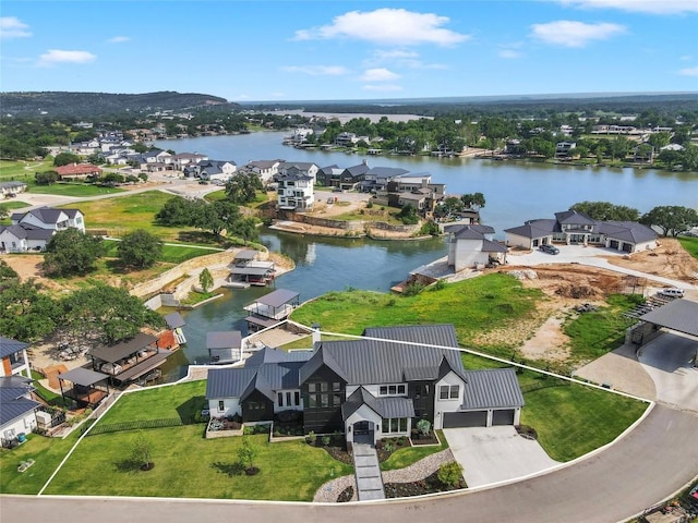 aerial view featuring a water view and a residential view