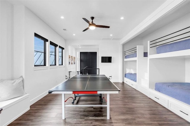 rec room featuring dark wood-style floors, baseboards, and recessed lighting