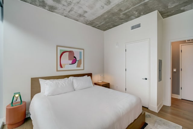 bedroom featuring hardwood / wood-style floors