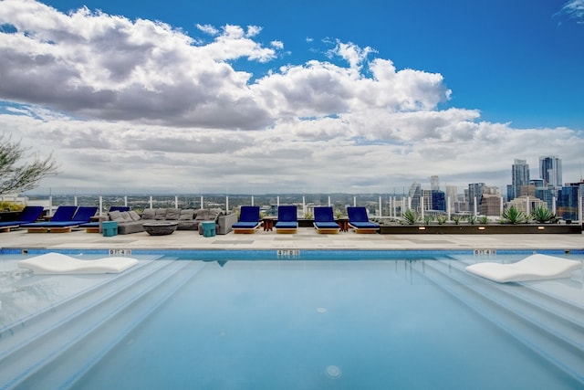 view of pool featuring a patio area