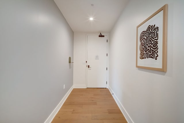 hall with wood-type flooring