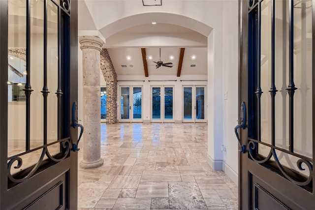 entryway featuring decorative columns, beamed ceiling, and ceiling fan